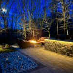 outdoor patio area at night illuminated by warm lighting