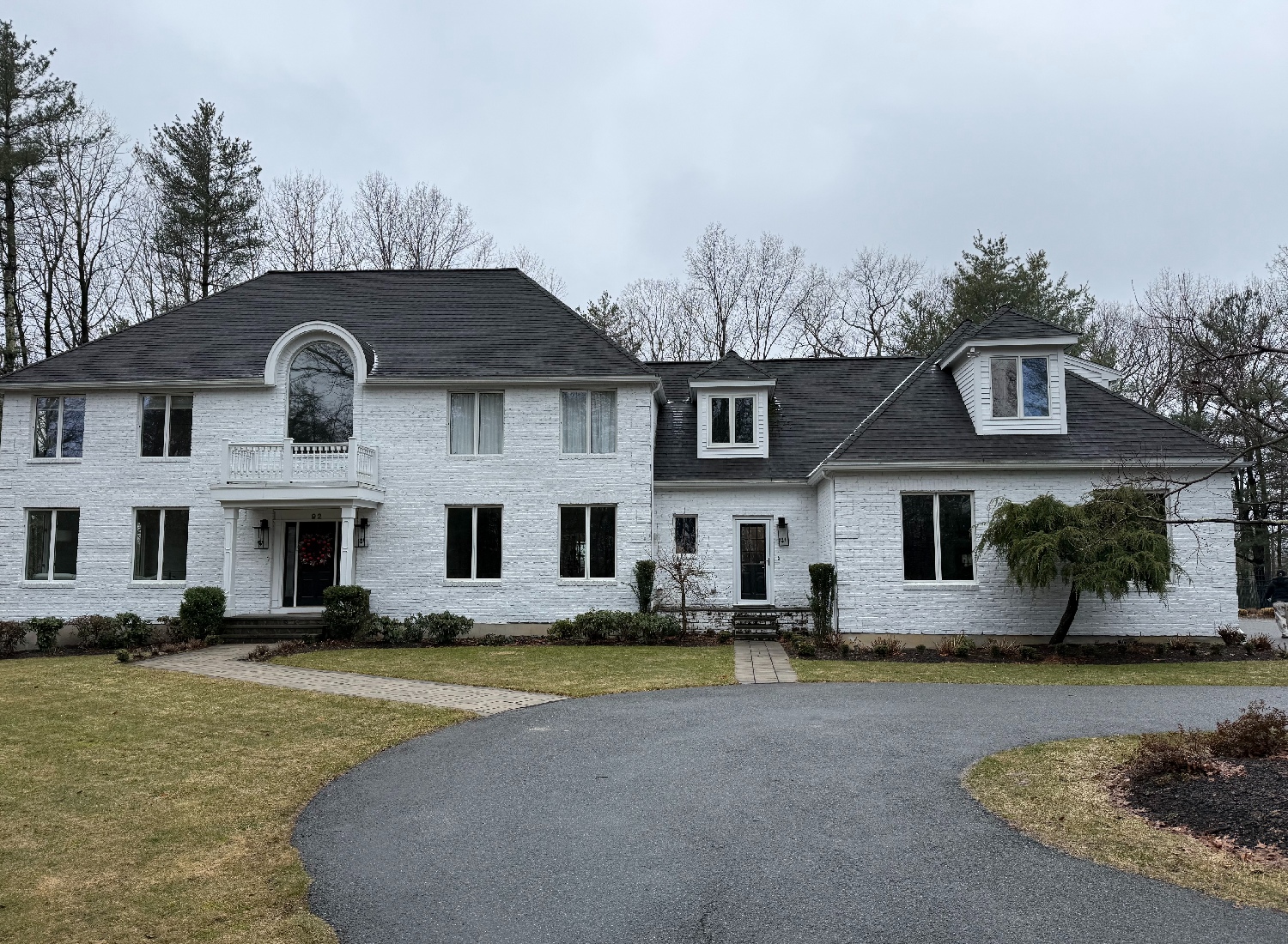 Daytime view of Massachusetts home before outdoor lighting design installation by NightView Outdoor Lighting