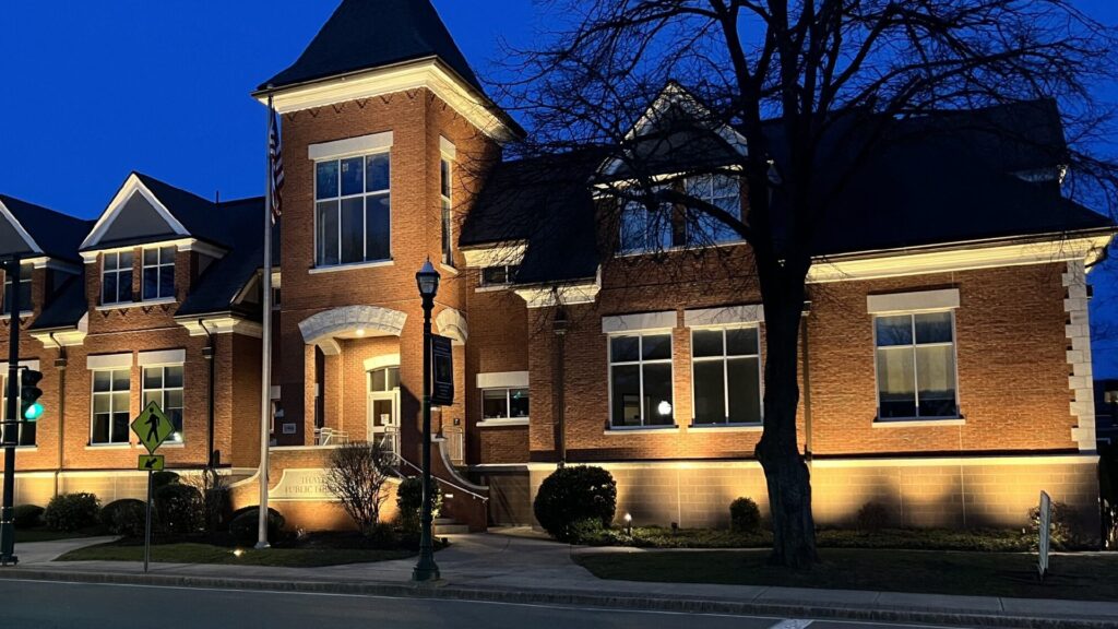 Building with landscape lighting design by NightView Outdoor Lighting